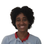 Smiling person facing the camera, wearing a light blue shirt with a red collar/scarf visible at the neck.