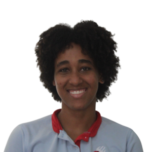 Smiling person facing the camera, wearing a light blue shirt with a red collar/scarf visible at the neck.